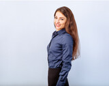 Beautiful happy toothy smiling business woman standing in blue shirt on grey background with empty copy space for text. Closeup banner portrait