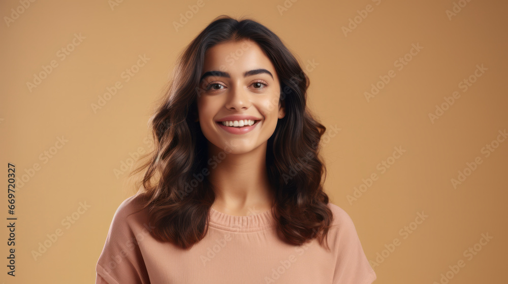 Poised Elegance: Joyful Young Spanish Woman's Portrait with Generous Copy Space on Pastel Beige Background. Poised Elegance: Joyful Young Spanish Woman's Portrait with Generous Copy Space on Pastel Beige Background.