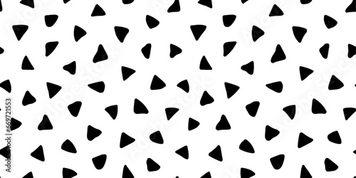 Vector seamless pattern. Irregular triangle texture. Cute abstract uneven triangular patern. Repeated random hands drawn spot. Repeating black scattered spotty on white background for design prints