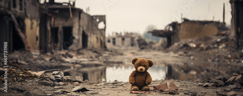 kids teddy bear toy over city burned destruction of an aftermath war conflict, earthquake or fire and smoke of world war against children peace innocence as copyspace banner photo