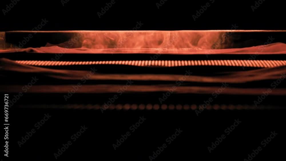 A Conveyor Belt Passes Through The Oven, Make A Print On T-Shirts A Conveyor Belt Passes Through The Oven, Make A Print On T-Shirts