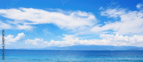 Gorgeous tropical sea with white cloud against blue sky for travel and vacation