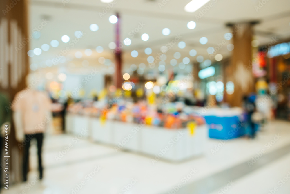 Abstract blurred of people in shopping mall of department store for background