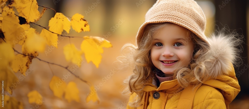 Lovely young girl strolling through fall park Lovely young girl strolling through fall park