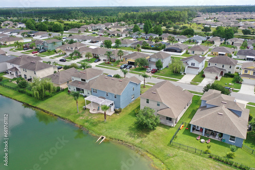 Aerial view of lakefront homes in a middle class suburban neighborhood, Florida.