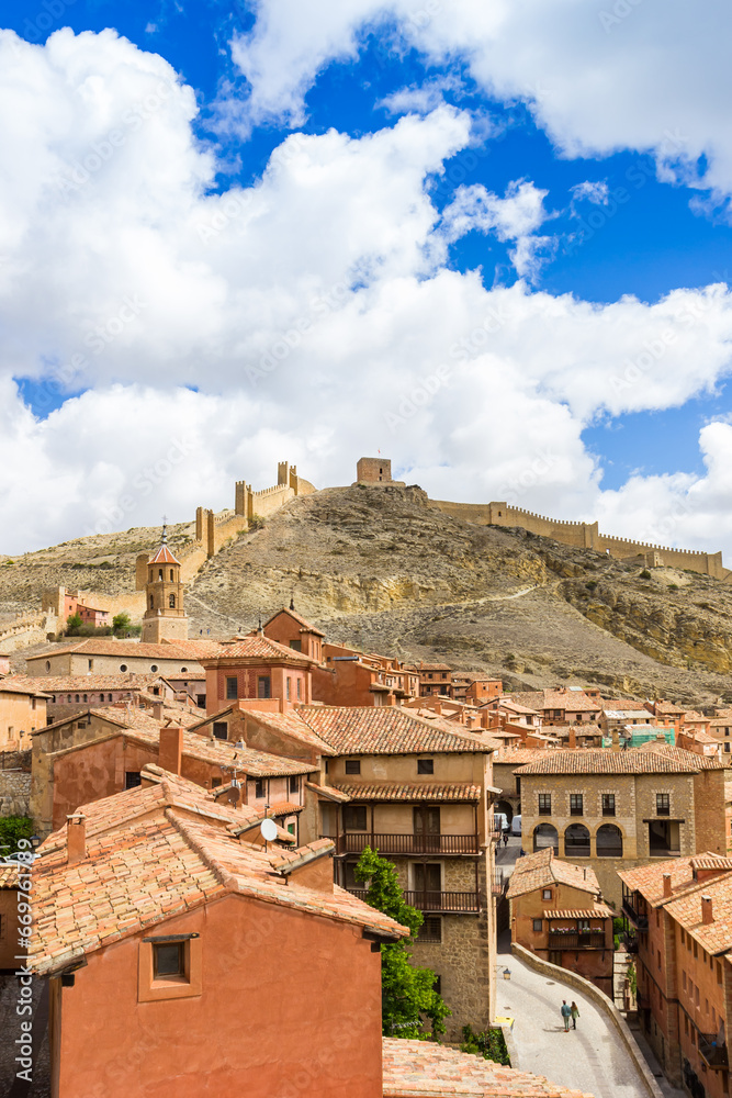 View over rooftops and the historic wall on the hill in Albarracin, Spain