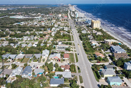 Aerial view of Daytona Beach, Florida looking north showing neighborhoods, beach front condos and hotels, along Florida RT A1A and the Atlantic Ocean. 