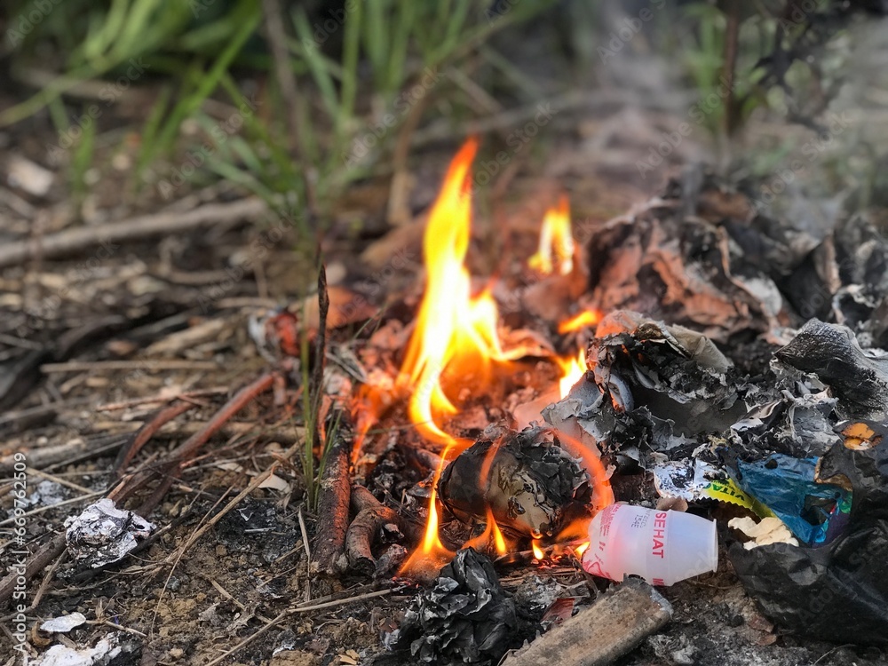 rubbish burn on the ground. waste burning rubbish burn on the ground. waste burning