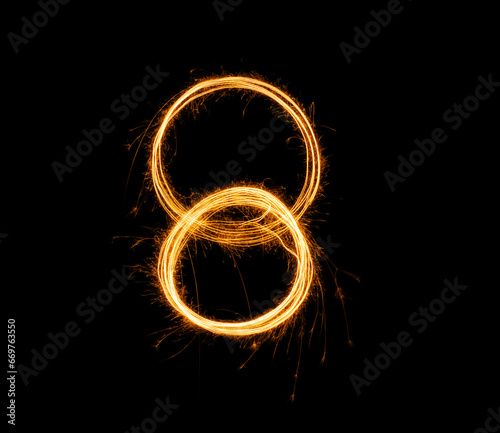 Fireworks numbers 8 Burning sparkler Numbers isolated on black background. Sparkler firework light alphabet 8 and number eight. Numbers Alphabet of Sparklers