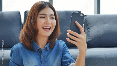 Asian women smile look at camera call video conference outdoor in modern city. Young woman say hi talking bye bye smile to camera. Happiness Businesswoman video call technology lifestyle concept