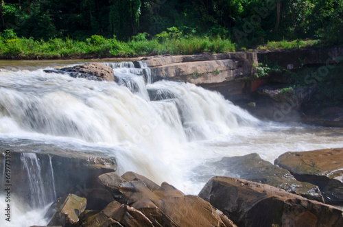 Beautiful bright waterfall on rock cliff