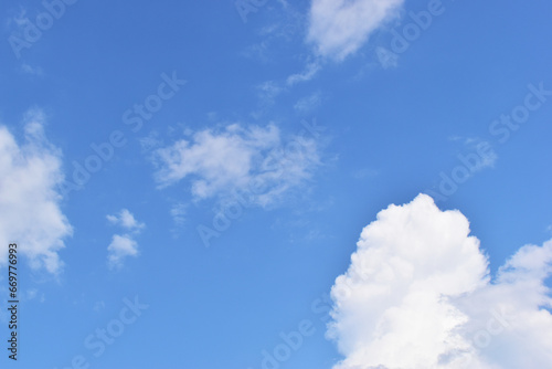 beautiful blue sky and white fluffy group of clouds with sunrise in the morning  natural background