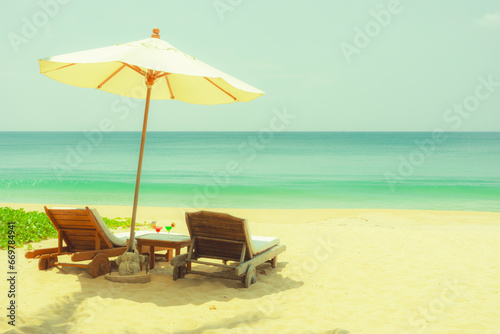 Fototapeta Naklejka Na Ścianę i Meble -  beach chairs and umbrellas on the beach,toned