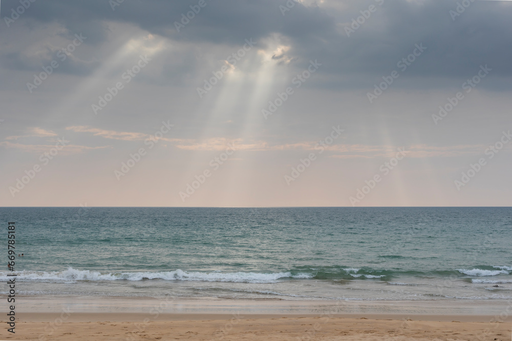sunset on the beach,with lighting beams