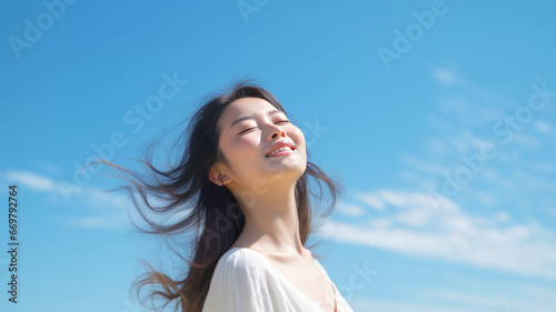 Young Japanese woman with radiant smile practicing yoga outdoors