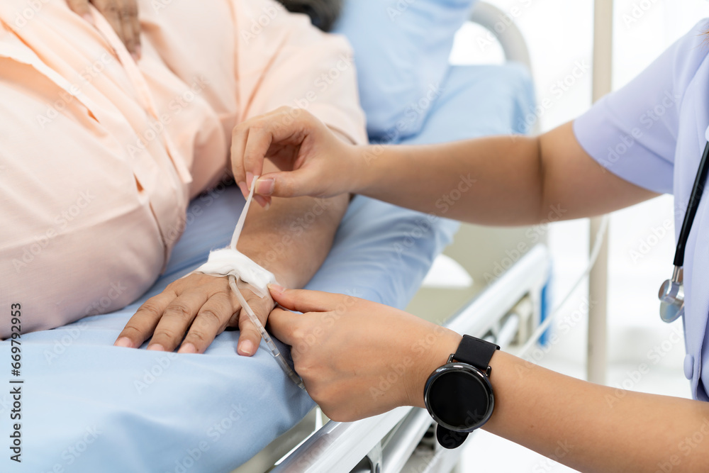 Nurse are verifying the accuracy of giving Saline to patients. Caregiver or nurse and senior concept. Nurse are verifying the accuracy of giving Saline to patients. Caregiver or nurse and senior concept.
