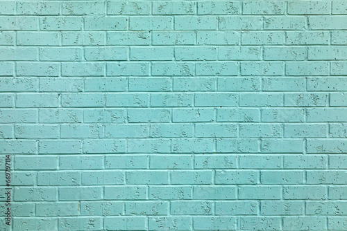 old brick wall painted in light blue
