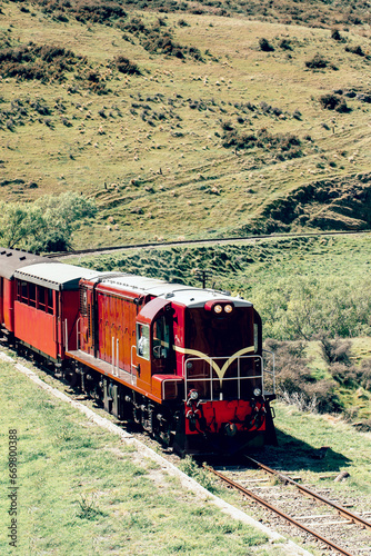 Diesel train on the railway surrounded by beautiful nature. Vehicle 