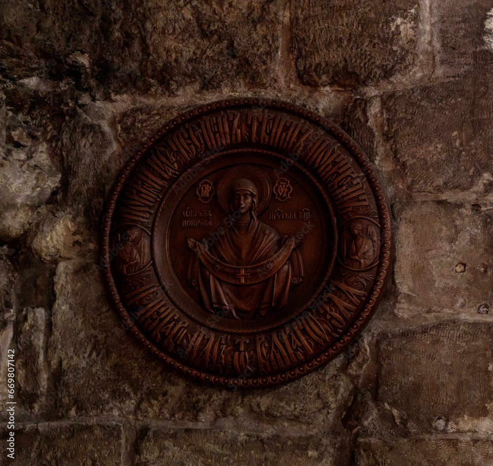 An icon with the image of the Intercession hangs on the wall of the lower hall of the Greek Orthodox Church of the Annunciation in Nazareth old city in northern Israel An icon with the image of the Intercession hangs on the wall of the lower hall of the Greek Orthodox Church of the Annunciation in Nazareth old city in northern Israel