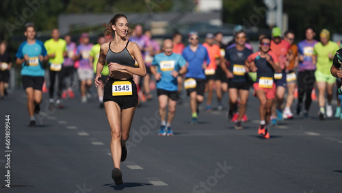 Female jogger run marathon. Thin girl work out. Woman runner jog long distance. Finish line road. Sportswoman overtake man. Sporty athlete train. Fast sprint champion. Fit sport body. Active city life
