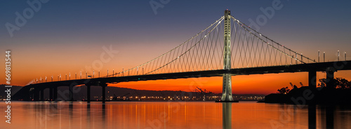 San Francisco / Oakland Bay Bridge During Colorful Sunrise  photo