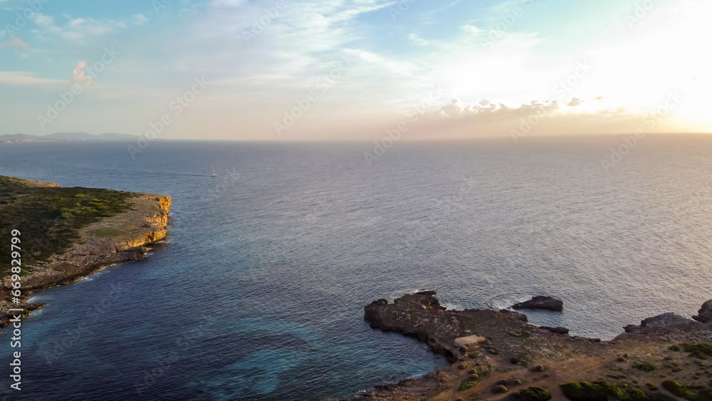 aerial drone view of the mediterranean coast at sunrise
