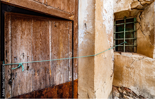 Door and window of an abandoned house photo