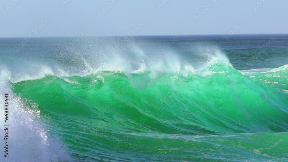 Cinematic slowmotion stunning aqua blue huge wave surf swell wind