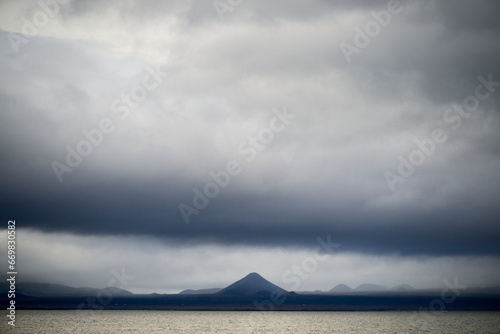 Cloudy dramatic sky over mountains and sea