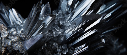 Close up photo of Stibnite quartz macro stone on black background photo