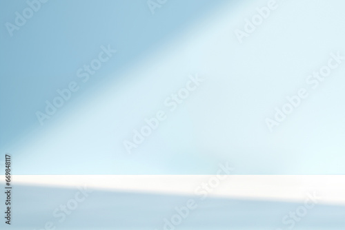 Empty room with a blue wall and white floor, adorned with the sunshine from window background. High quality photo