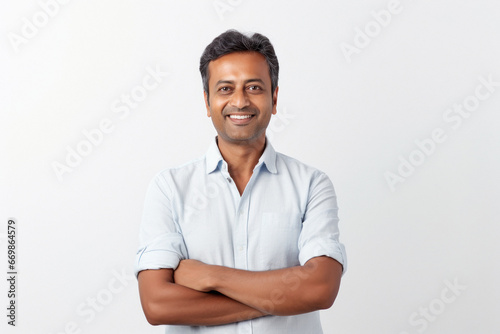 Confident indian man standing and smiling.