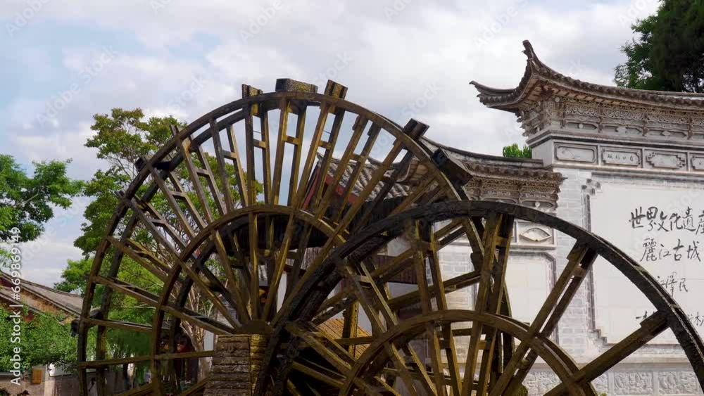 Old wooden water wheel and landmark, historic old town of Lijiang, Yunnan, China, Asia Old wooden water wheel and landmark, historic old town of Lijiang, Yunnan, China, Asia