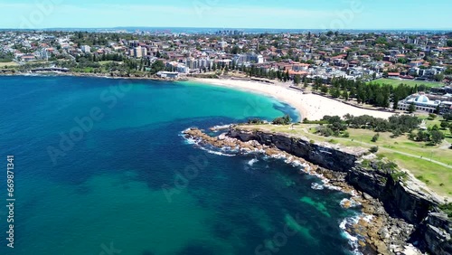 Drone aerial shot of Coogee Bay Beach beachside headland coastline cliff housing infrastructure Randwick Bondi Maroubra Eastern Suburbs travel tourism Sydney NSW Australia 4K photo