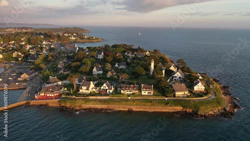 Drone shot, drone flight along the coast, beach, from the Atlantic Ocean to the port of Port Navalo in Arzon in the evening light, marina with sailboats, department of Morbihan, Brittany, France photo