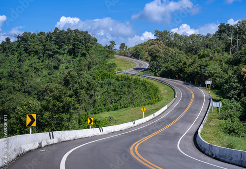 The road is similar to the number 3, This road is built on a mountain, past the forest in Nan Province of Thailand. The zigzag road number 3. Good scenery, famous, and have tourists to take pictures. © somchairakin