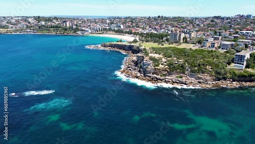 Drone aerial landscape nature cliff face coastline view rocky headland Gordons Bay Clovelly Coogee Beach Sydney housing market suburb ocean surf NSW travel tourism Australia 4K
