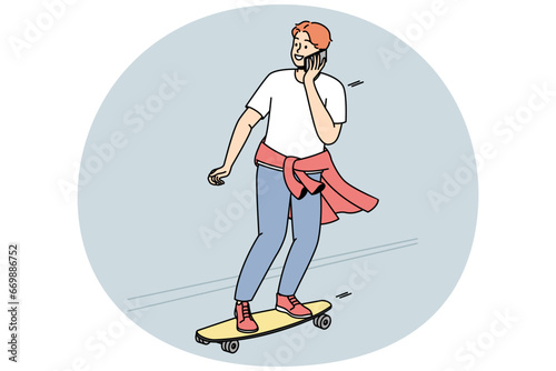 Guy is rolling on skateboard down street and talking on cellphone at same time. Boy practices skateboarding outdoor. Teenager moves on road on longboard, chats on smartphone. Vector graphics in color.