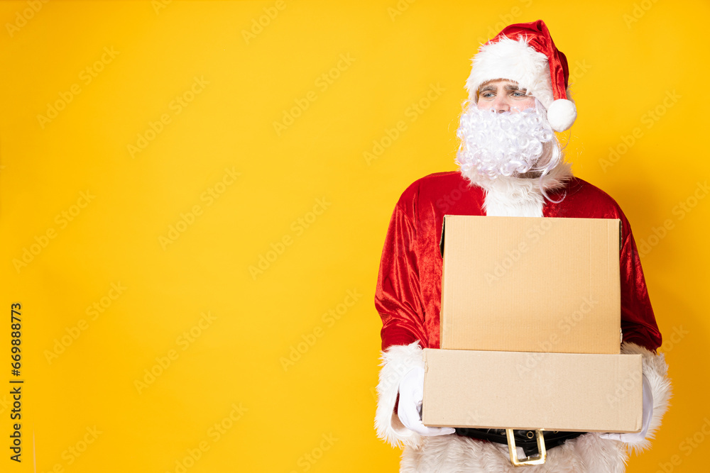 Santa Claus, with boxes, on a yellow background. Santa Claus, with boxes, on a yellow background.