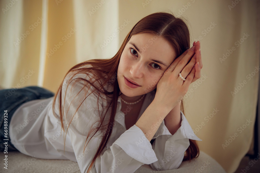 Young beautiful girl in white shirt and blue jeans Young beautiful girl in white shirt and blue jeans