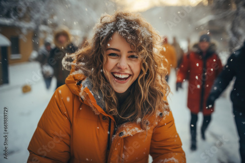 Happy excited satisfied young girl rejoices outdoors during wintertime photo