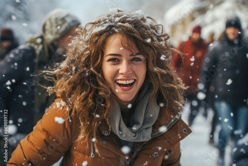 Happy excited satisfied young girl rejoices outdoors during wintertime