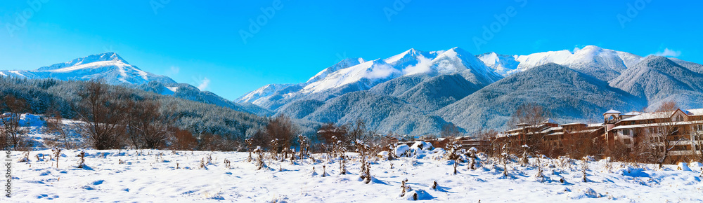 Bansko houses and snow mountains panorama, Bulgaria