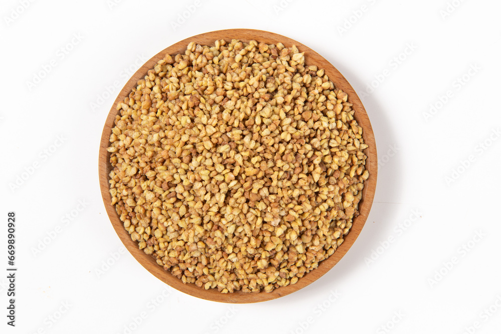 dry buckwheat isolated on white background.