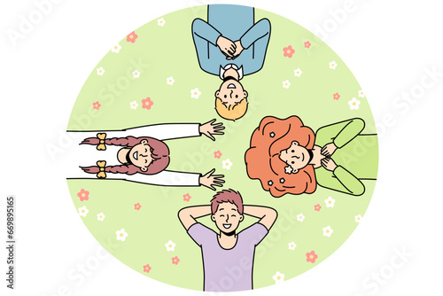 Guys, girls lie on grass among flowers in different directions, look at sky, laugh. Friends spend time at lawn. Top view. Hello spring, summer concept. Vector colorful outline illustration.