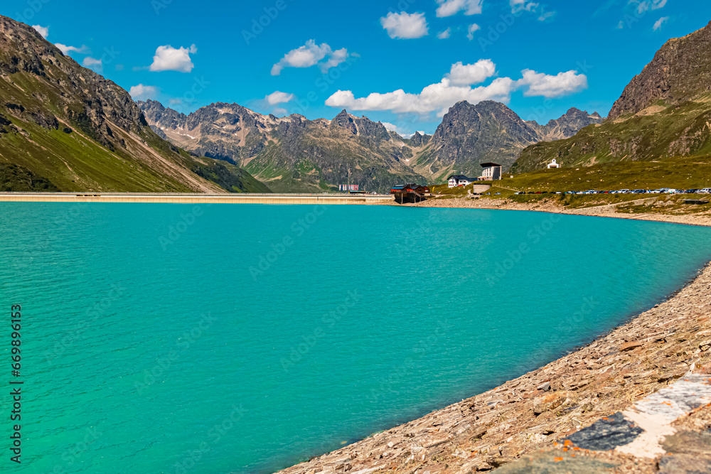 Alpine summer view with reflections in a lake at Sylvretta reservoir, Sylvretta-High-Alps-Street, Bielerhoehe, Vorarlberg, Tyrol, Austria