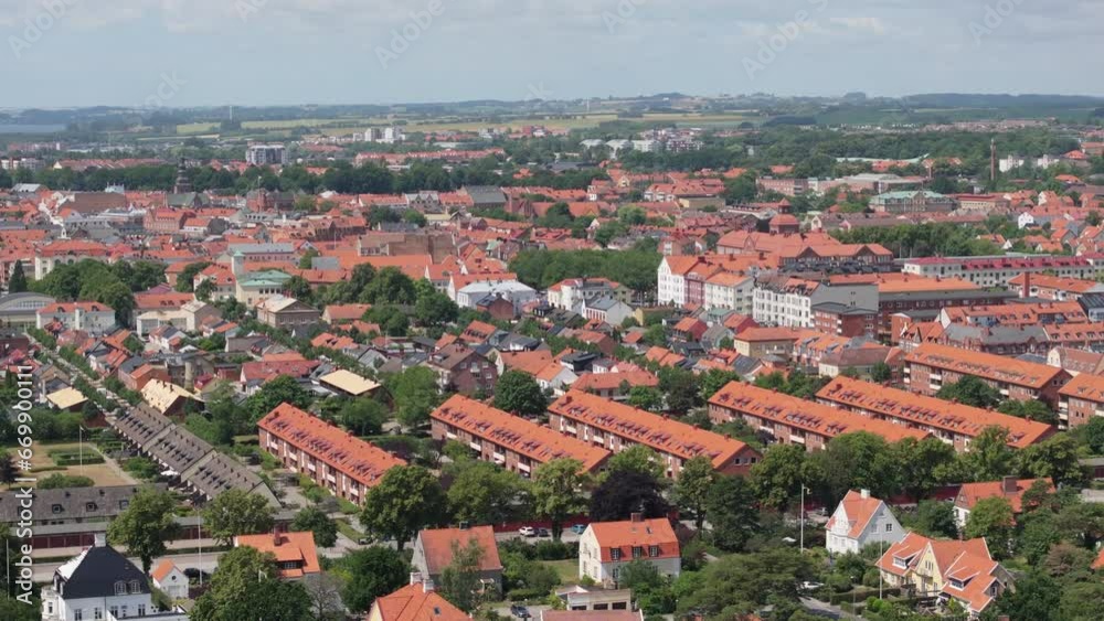 Skyline of Swedish city Ystad on a sunny summer day, aerial telephoto orbit Skyline of Swedish city Ystad on a sunny summer day, aerial telephoto orbit