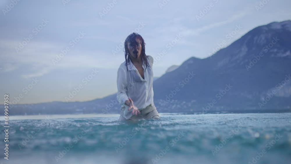 Woman dancing in a lake Woman dancing in a lake