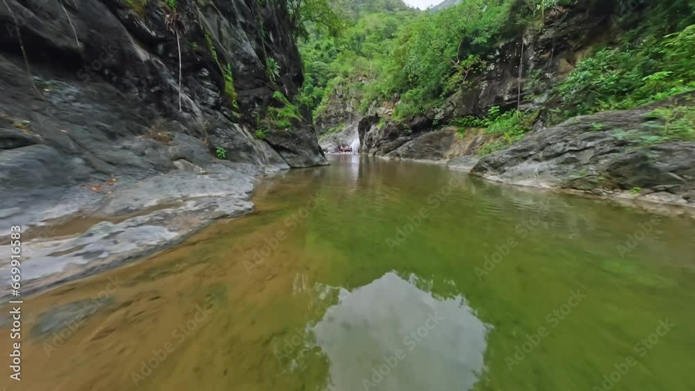 FPV speed drone flight over clear natural river in jungle of Dominican Republic FPV speed drone flight over clear natural river in jungle of Dominican Republic