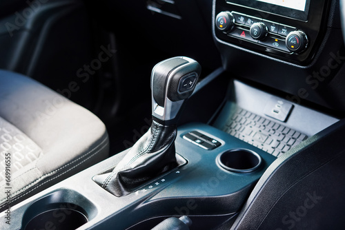 automatic transmission shift selector in the car interior. Closeup a manual shift of modern car gear shifter. 4x4 gear shift photo